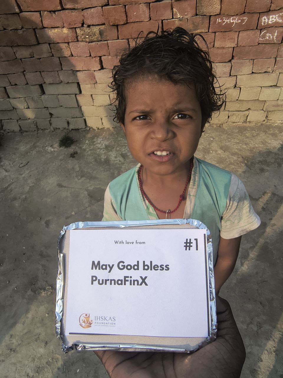 Purna with orphan children at shelter